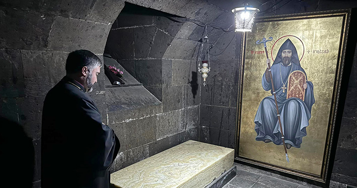 Bishop Mesrop Parsamyan at Mesrop Mashtots' tomb in Oshakan, Armenia.